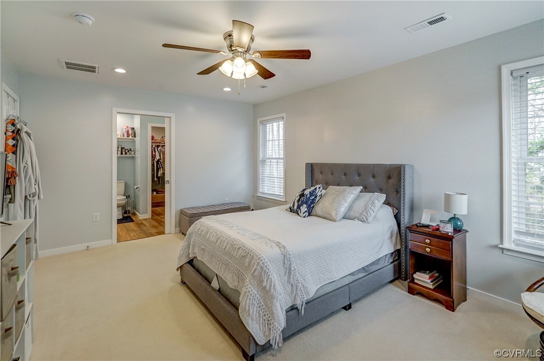 3334 Three Chopt Road Gum Spring, VA 23065 - Photo 29 of 44 a bedroom with a bed and a chandelier
