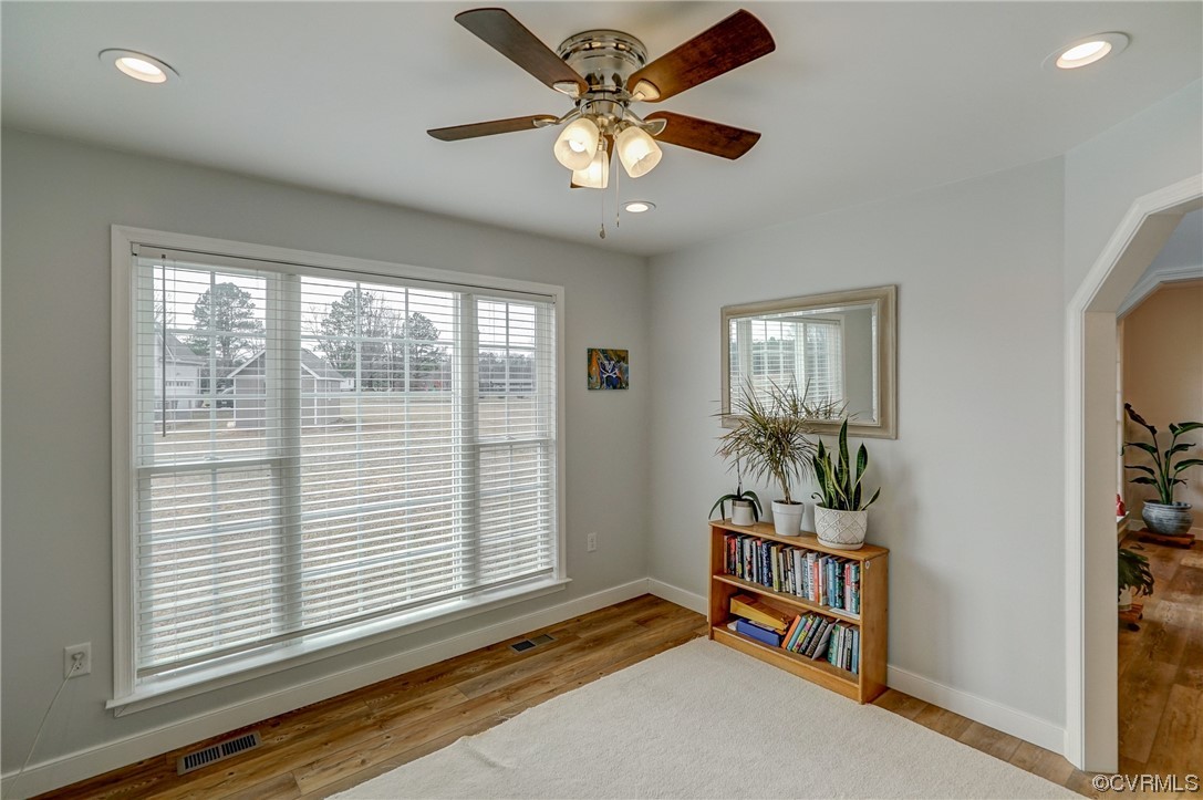 3334 Three Chopt Road Gum Spring, VA 23065 - Photo 34 of 44 an empty room with windows and ceiling fan