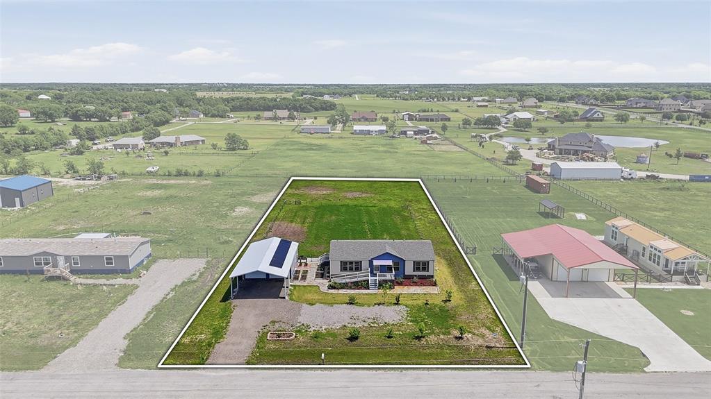 an aerial view of a house with outdoor space