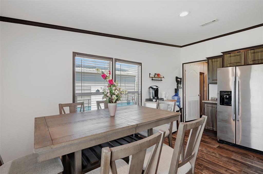 1113 Caroline Court Howe, TX 75459 - Photo 11 of 32 a dining room with furniture and wooden floor