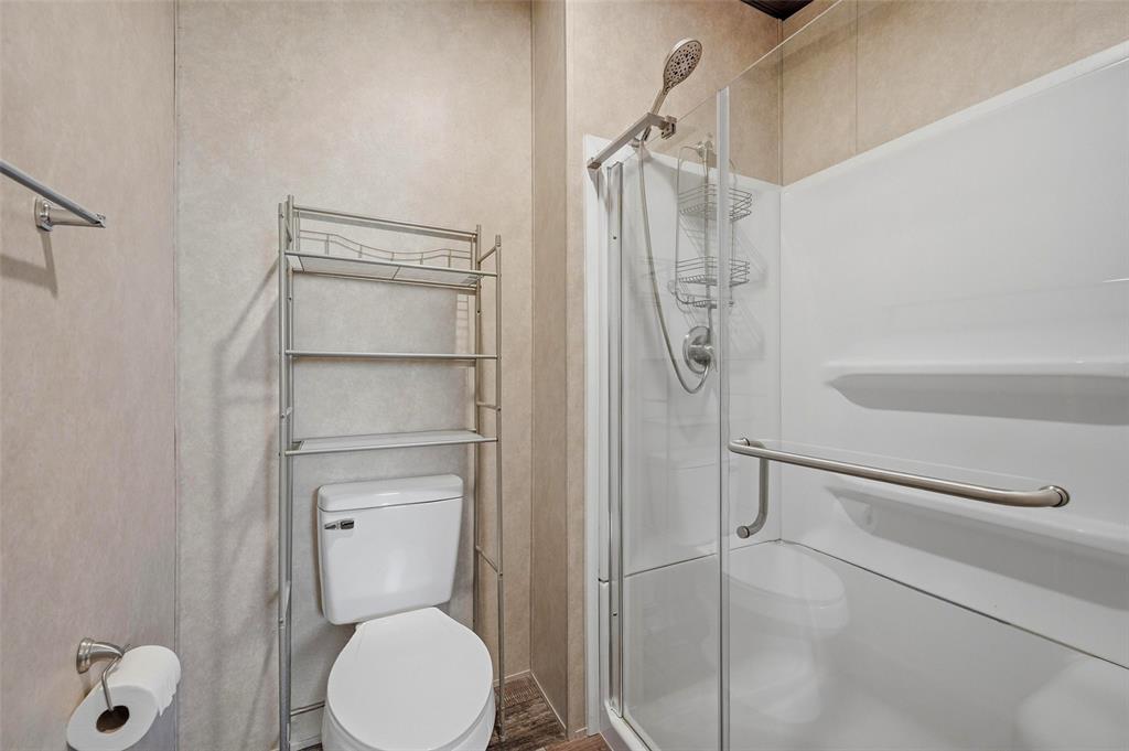 1113 Caroline Court Howe, TX 75459 - Photo 18 of 32 a bathroom with a toilet and a shower