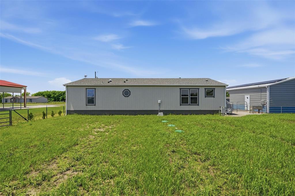 1113 Caroline Court Howe, TX 75459 - Photo 25 of 32 a view of a house with a backyard