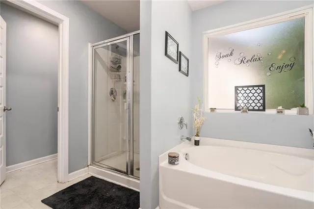 a bathroom with a bathtub and shower