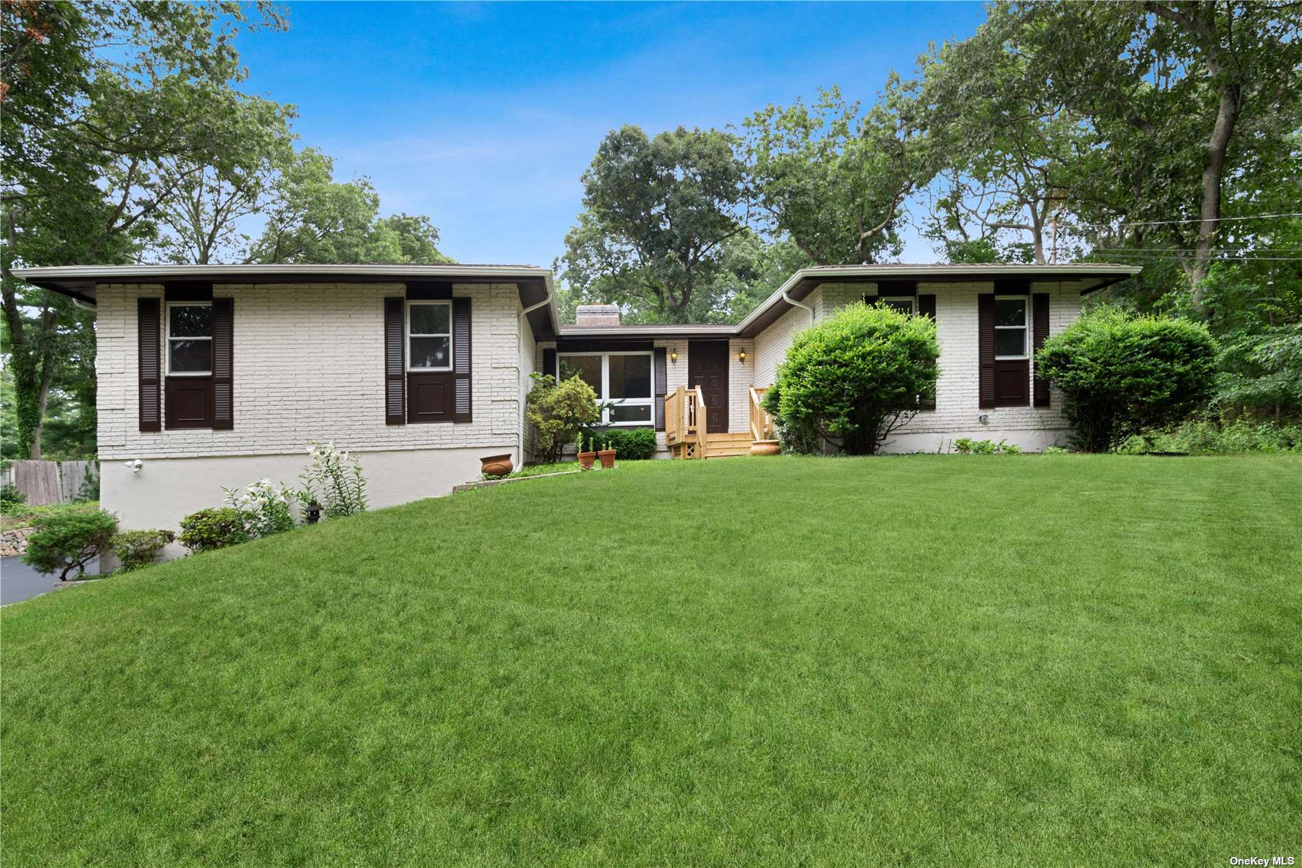 549 Pond Path East Setauket, NY 11733 - Photo 1 of 1 a front view of house with yard and green space