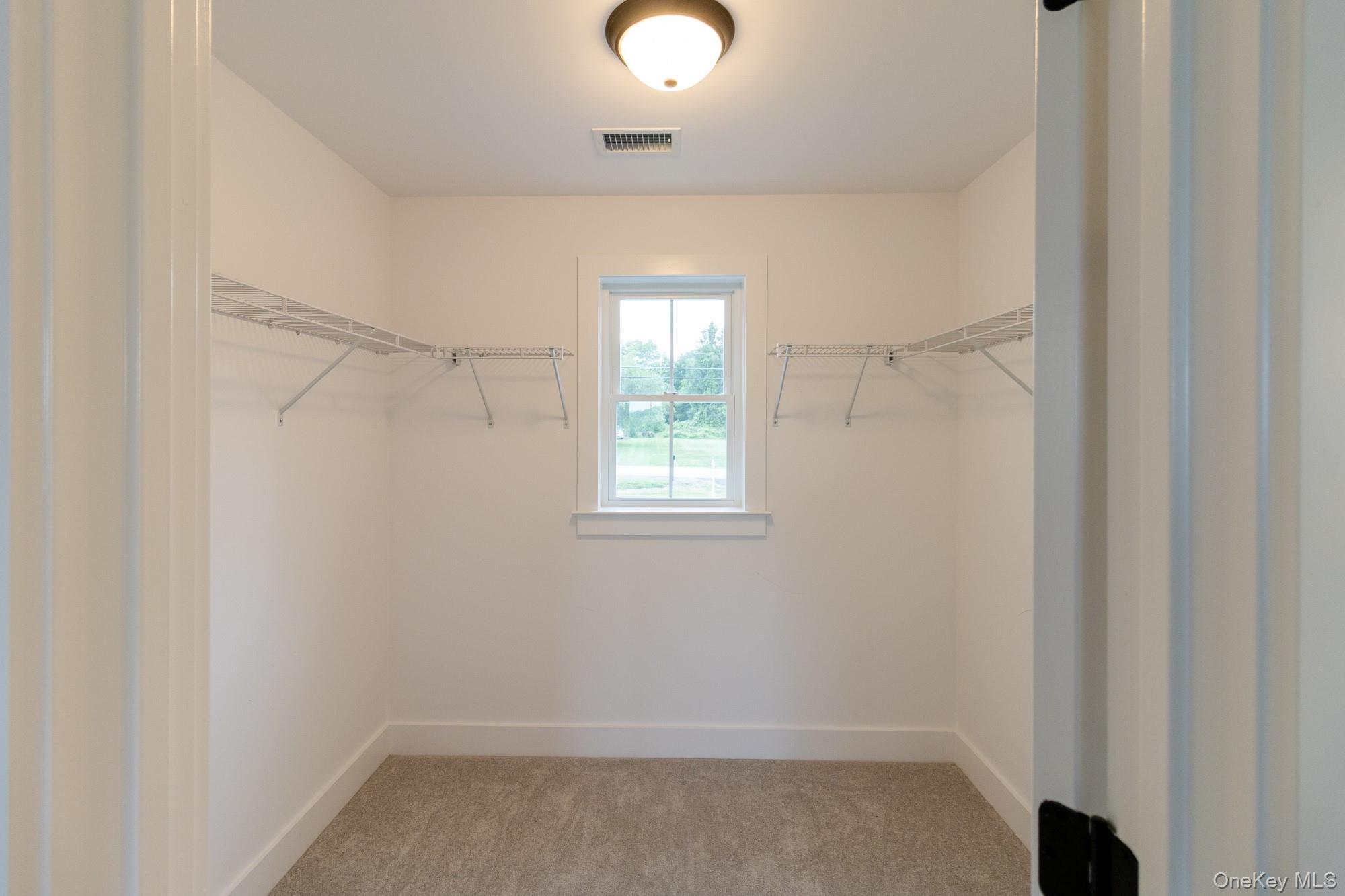 750 Ridgebury Road Slate Hill, NY 10973 - Photo 21 of 41 wooden floor in an empty room with a window