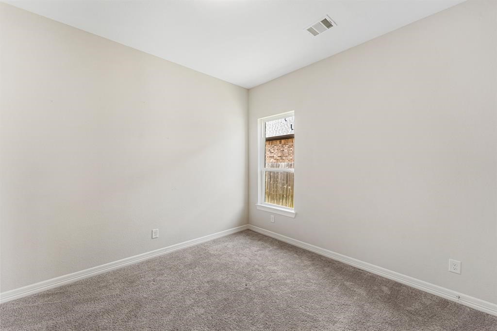2311 Jitterbug Lane Katy, TX 77493 - Photo 18 of 25 an empty room with a window