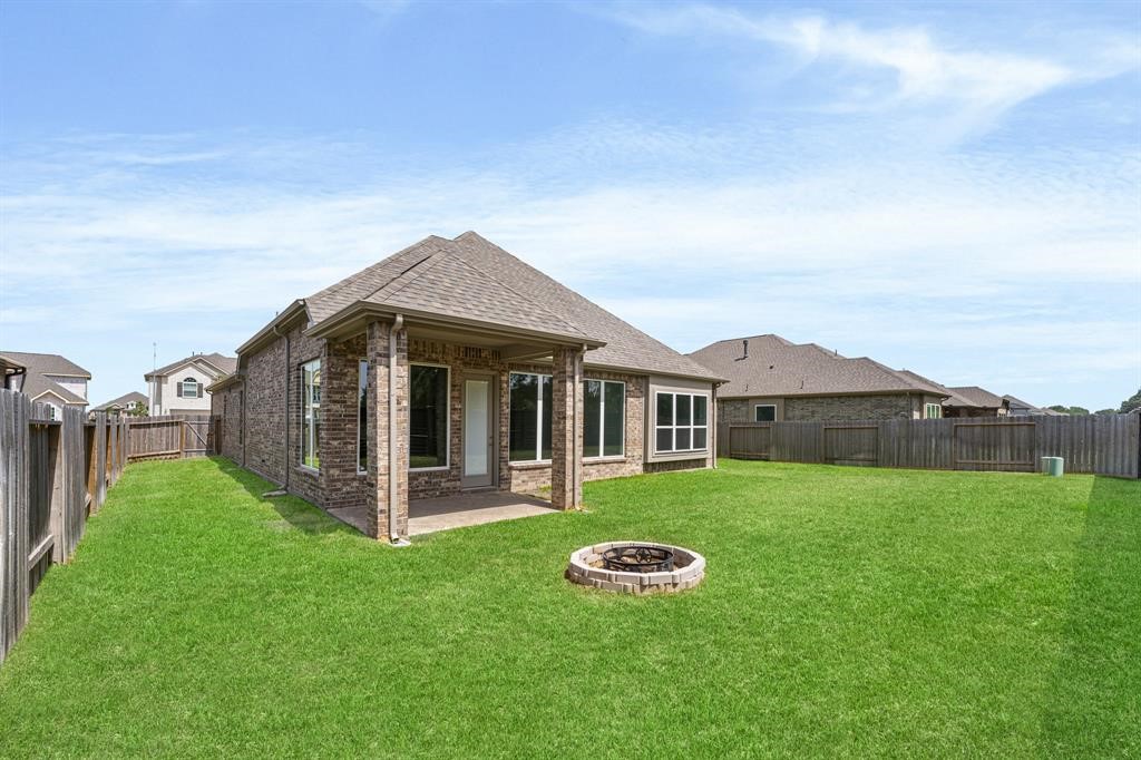 2311 Jitterbug Lane Katy, TX 77493 - Photo 22 of 25 a view of a house with backyard and porch