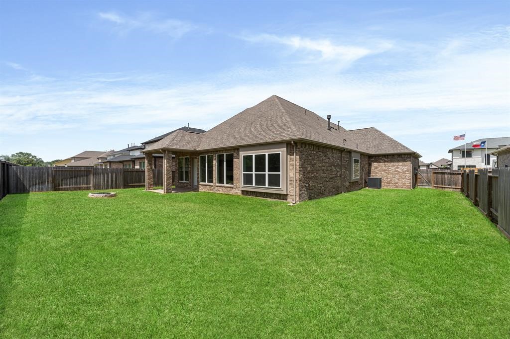 2311 Jitterbug Lane Katy, TX 77493 - Photo 24 of 25 a view of a house with a big yard