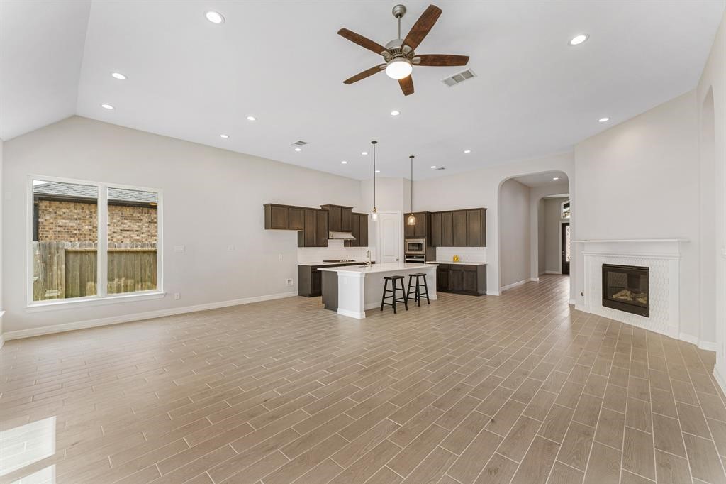 2311 Jitterbug Lane Katy, TX 77493 - Photo 7 of 25 a view of kitchen with furniture and wooden floor