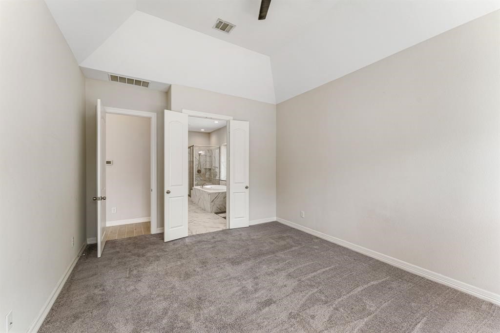 2311 Jitterbug Lane Katy, TX 77493 - Photo 9 of 25 an empty room with a bathroom