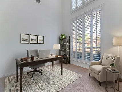 a work room with furniture and a window