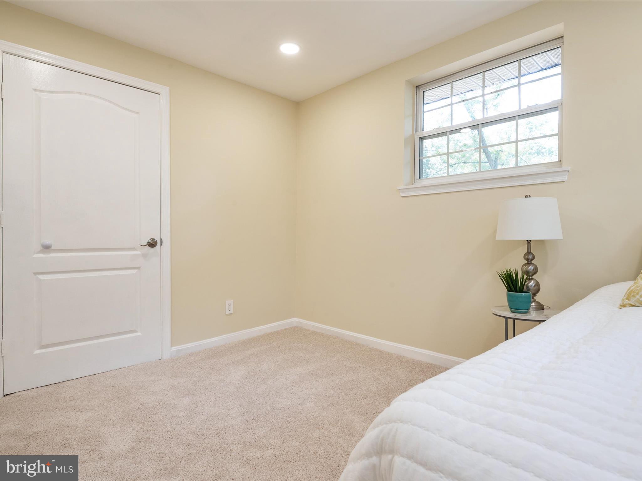1395 Rainbow Drive Pasadena, MD 21122 - Photo 15 of 28 a bedroom with a bed and a window