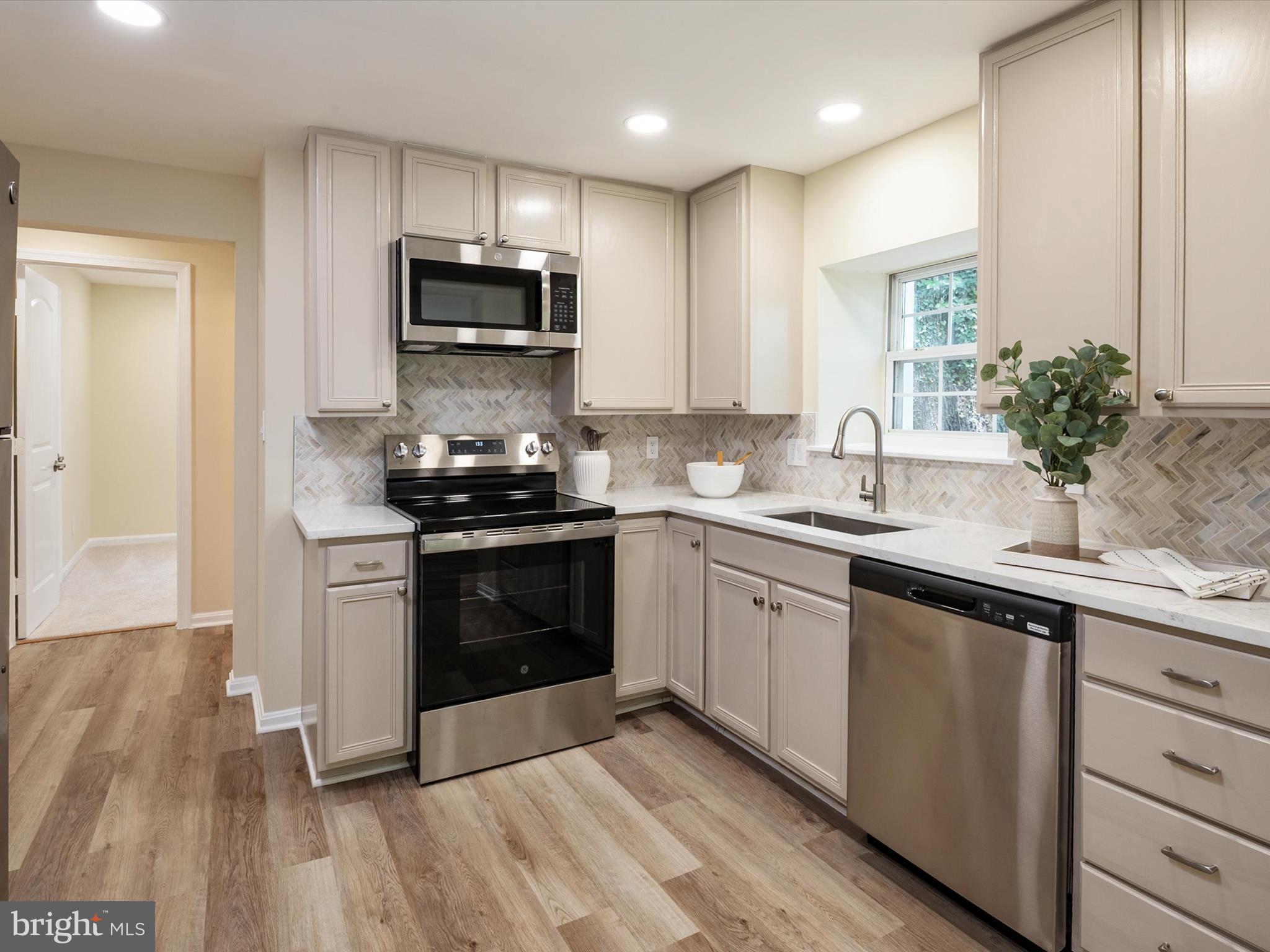1395 Rainbow Drive Pasadena, MD 21122 - Photo 18 of 28 a kitchen with a sink and steel appliances