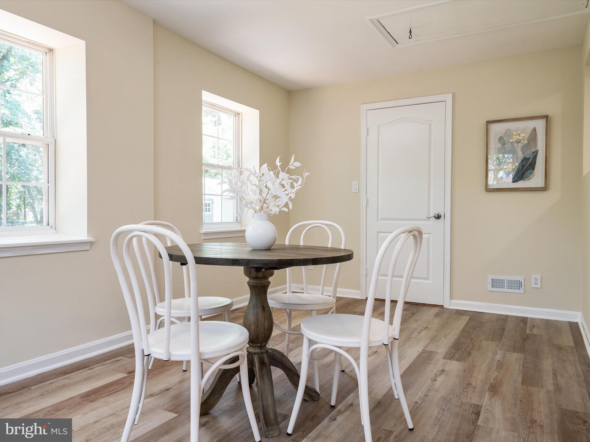 1395 Rainbow Drive Pasadena, MD 21122 - Photo 20 of 28 a view of a dining room with furniture and wooden floor