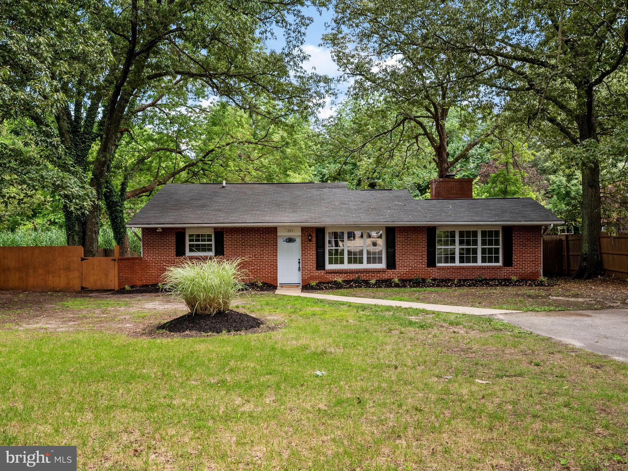 1395 Rainbow Drive Pasadena, MD 21122 - Photo 3 of 28 a front view of a house with a garden