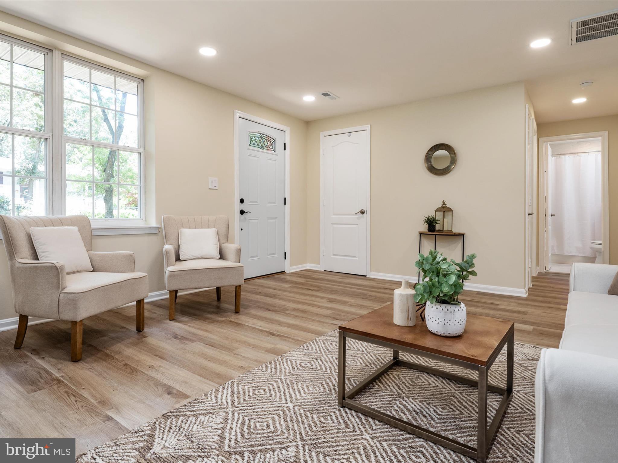 1395 Rainbow Drive Pasadena, MD 21122 - Photo 4 of 28 a living room with furniture and wooden floor