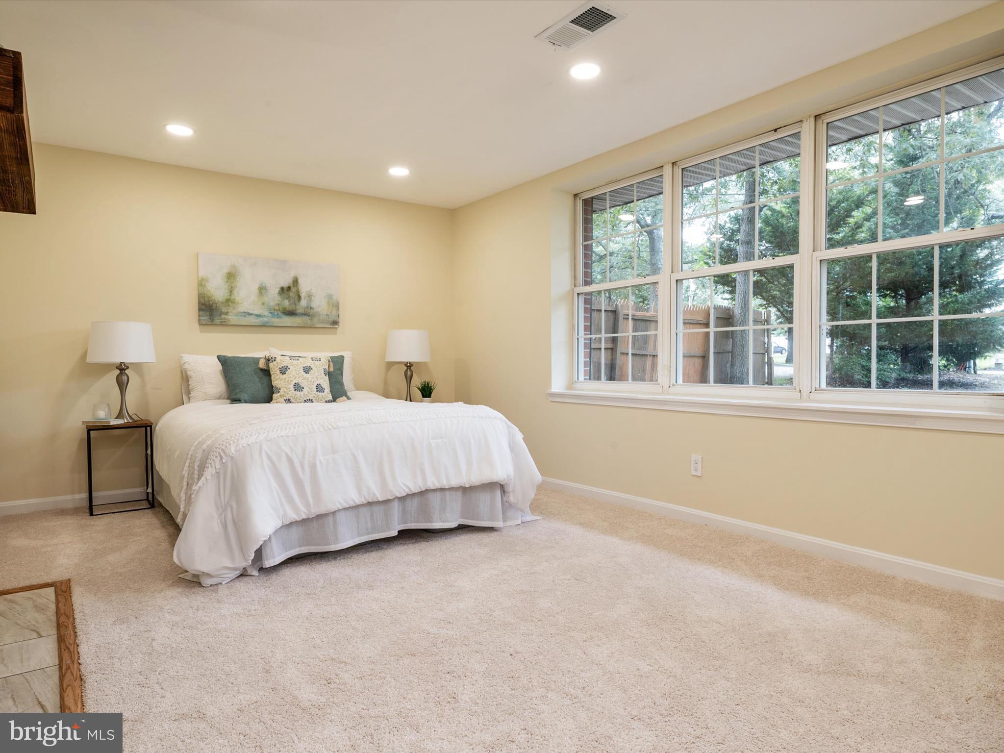 1395 Rainbow Drive Pasadena, MD 21122 - Photo 9 of 28 a bedroom with a bed and a large window