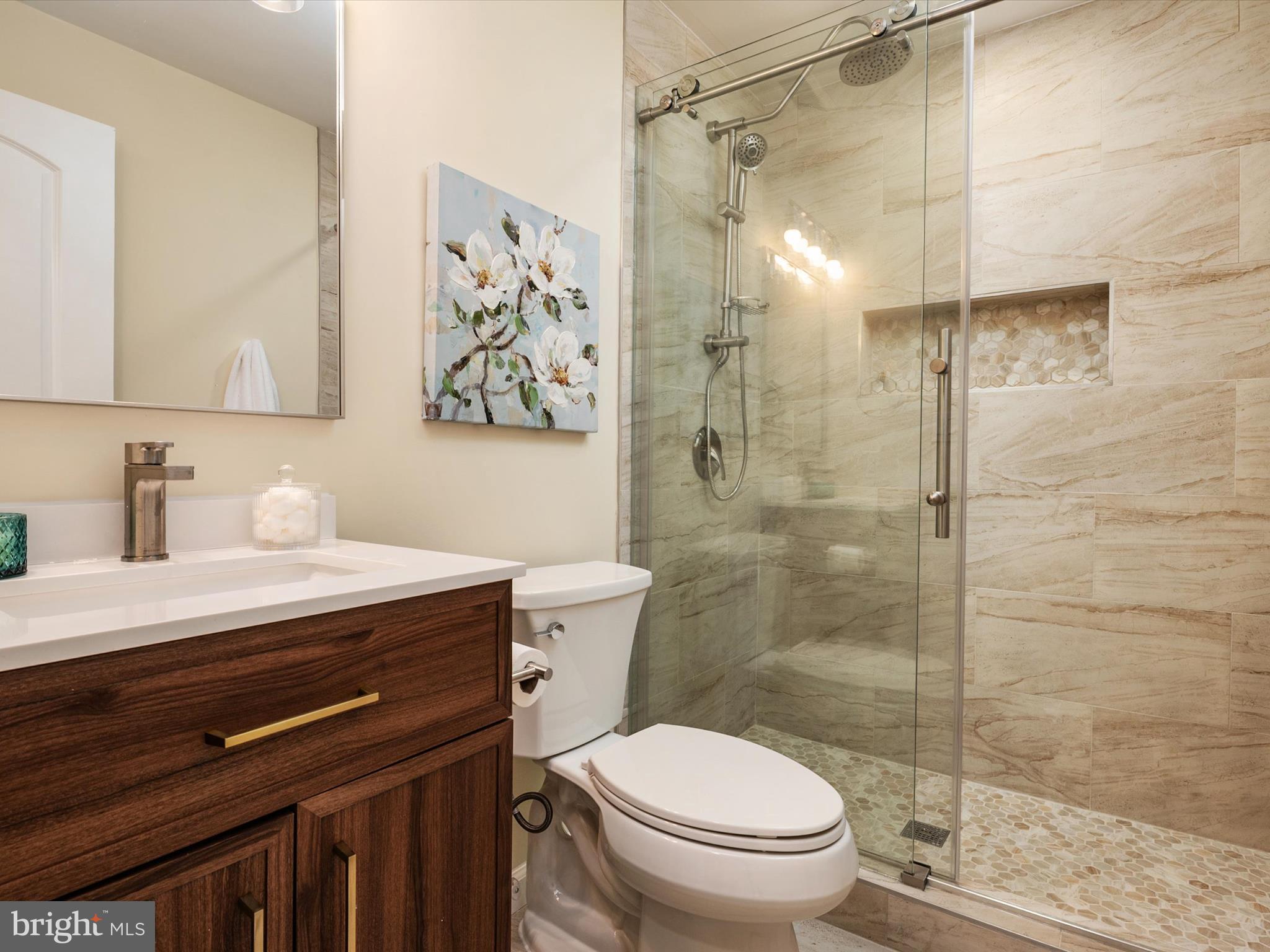 1395 Rainbow Drive Pasadena, MD 21122 - Photo 10 of 28 a bathroom with a sink toilet and shower