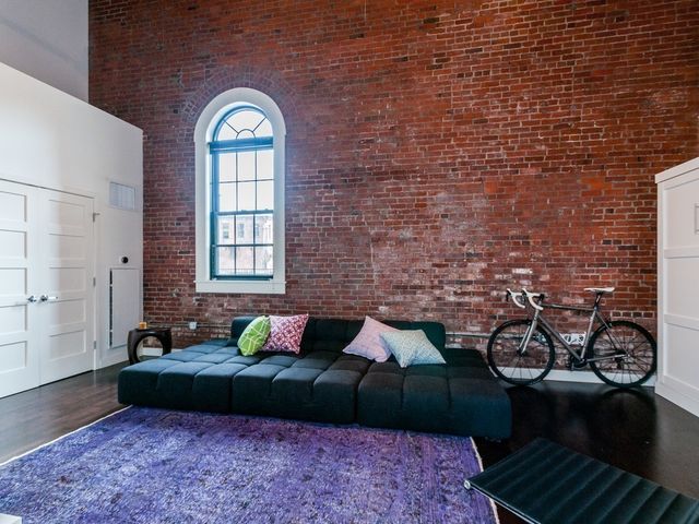a living room with furniture and a rug