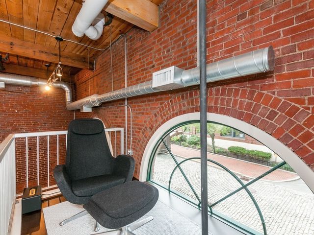 a bedroom with a bed and lamp