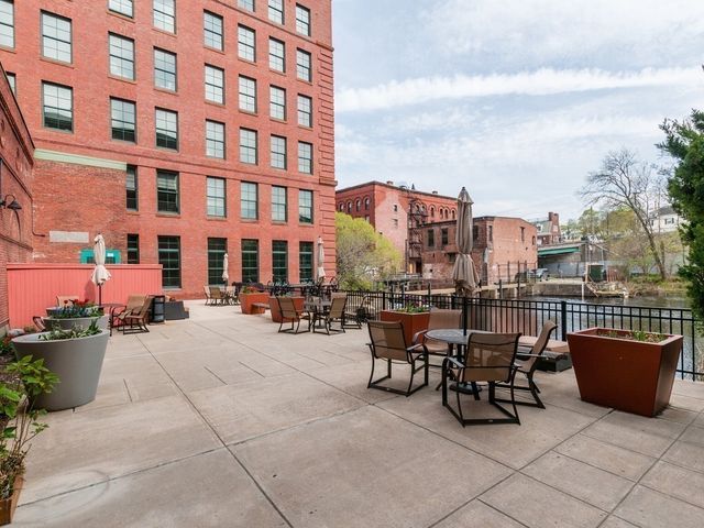 a view of a swimming pool with outdoor seating and lake