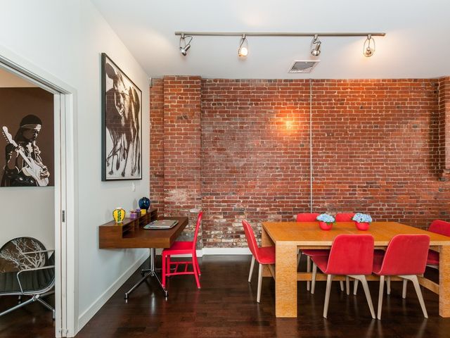 a view of a dining room with furniture and wooden floor