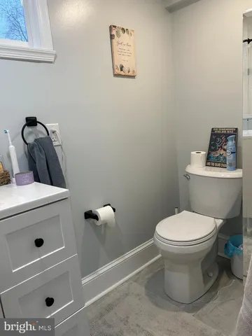 a bathroom with a toilet and a sink
