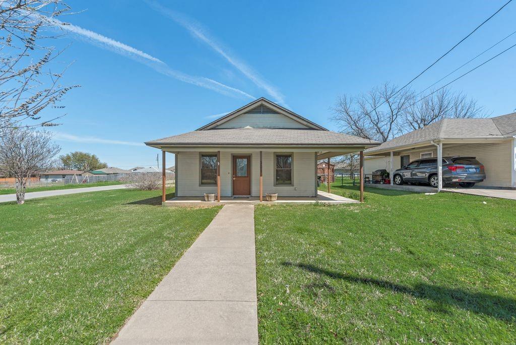 301 Lipscomb Street Cleburne, TX 76031 - Photo 21 of 21 Bungalow-style home with a front yard and a porch