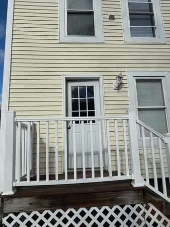 a view of a balcony with chairs