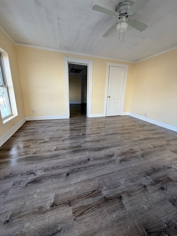 360 School Street, Unit 2 Webster, MA 01570 - Photo 8 of 21 wooden floor in an empty room with a window