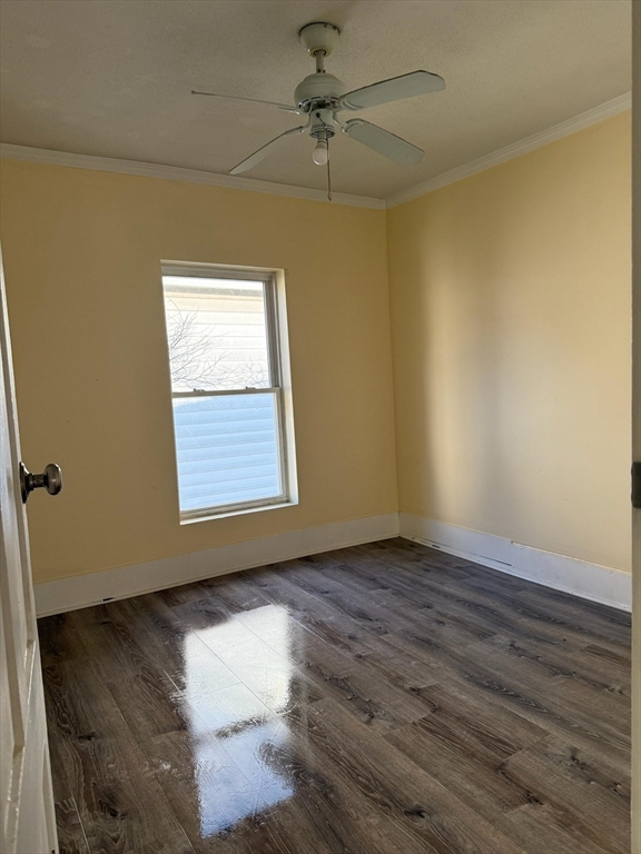 360 School Street, Unit 2 Webster, MA 01570 - Photo 10 of 21 an empty room with wooden floor chandelier fan and windows