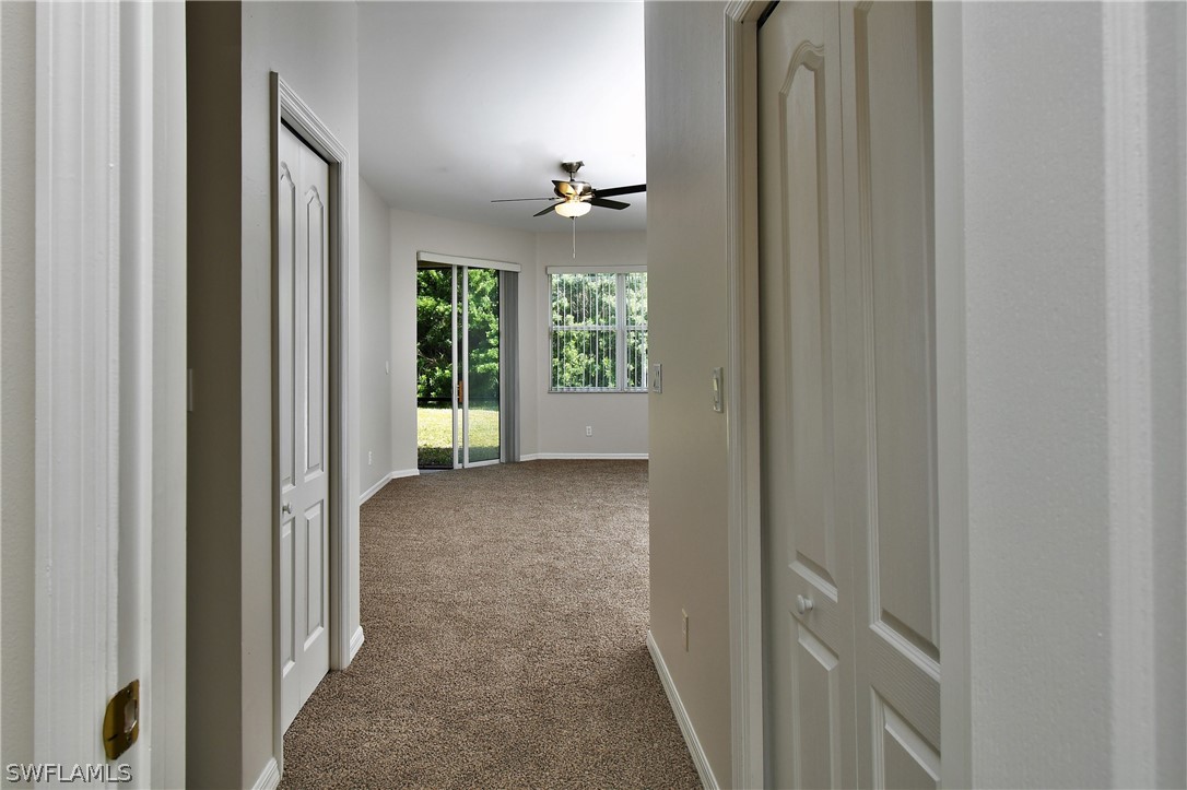 4612 Fairloop Run Lehigh Acres, FL 33973 - Photo 11 of 35 a view of a bathroom from a hallway