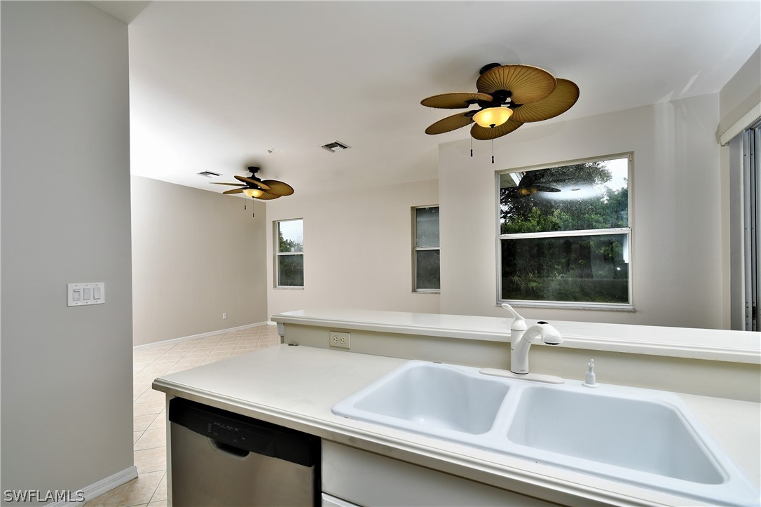 4612 Fairloop Run Lehigh Acres, FL 33973 - Photo 17 of 35 a bathroom with a sink and a mirror