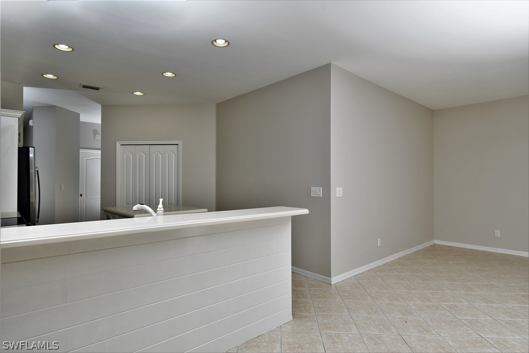 4612 Fairloop Run Lehigh Acres, FL 33973 - Photo 20 of 35 a room with a sink and a mirror