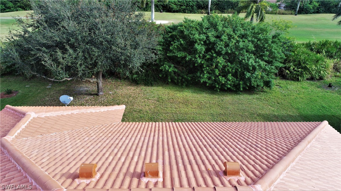 4612 Fairloop Run Lehigh Acres, FL 33973 - Photo 29 of 35 a view of a backyard