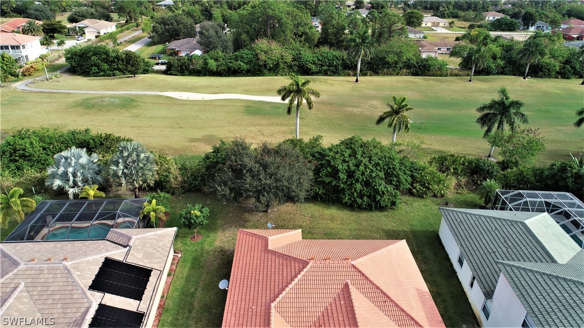 4612 Fairloop Run Lehigh Acres, FL 33973 - Photo 32 of 35 a view of a lake with a yard