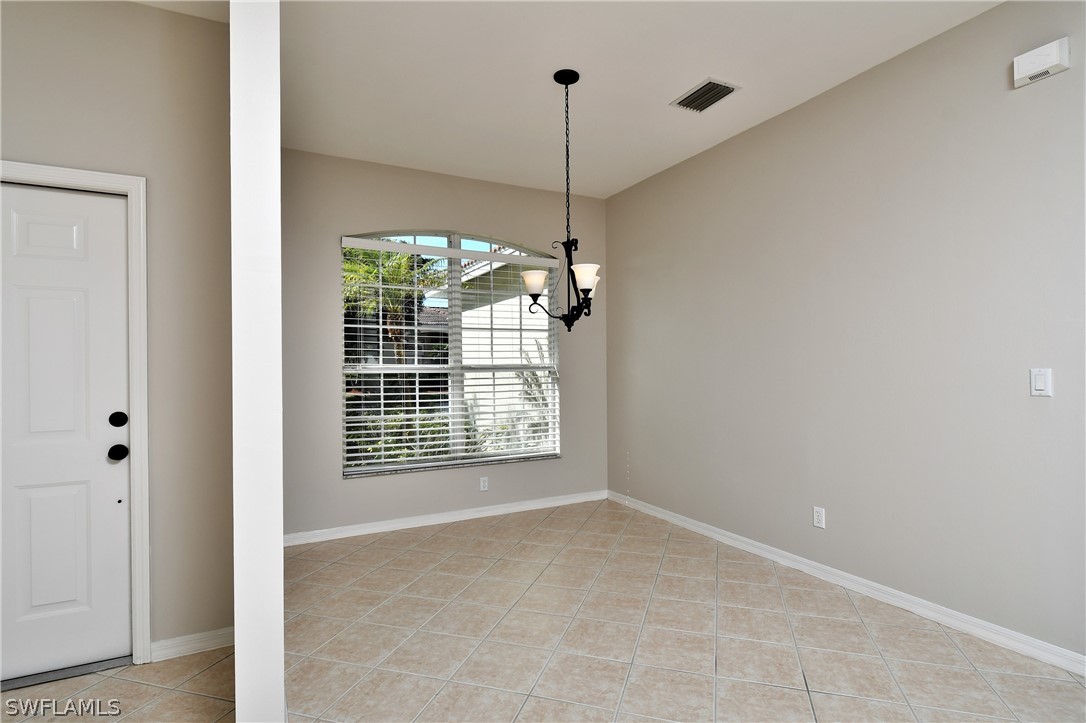 4612 Fairloop Run Lehigh Acres, FL 33973 - Photo 5 of 35 a view of an empty room with a window
