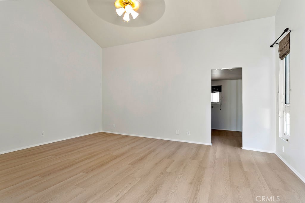 26 Tahoe Irvine, CA 92612 - Photo 22 of 40 a view of an empty room with wooden floor and a window