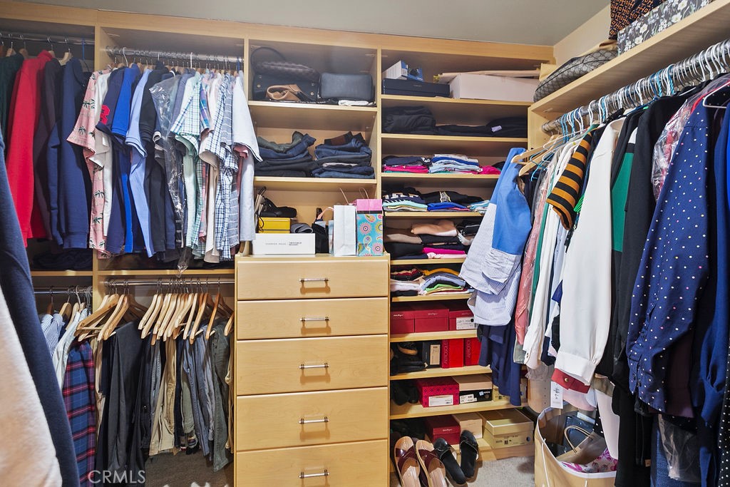 26 Tahoe Irvine, CA 92612 - Photo 26 of 40 a view of walk in closet with clothes and shoes