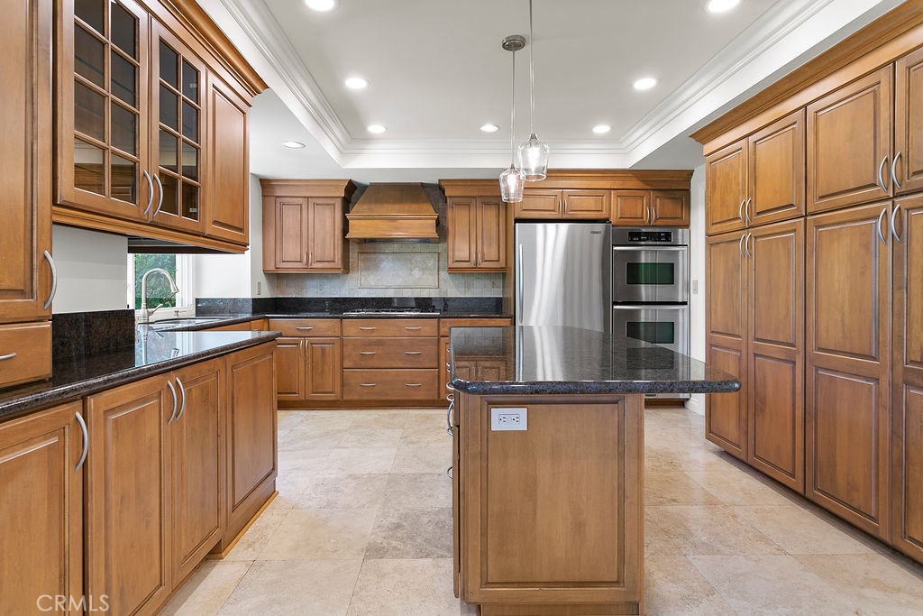 26 Tahoe Irvine, CA 92612 - Photo 27 of 40 a kitchen with stainless steel appliances granite countertop a refrigerator and a sink