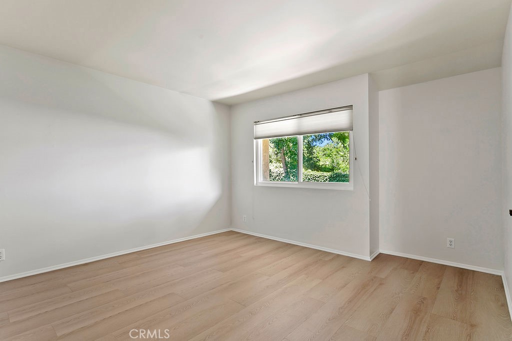 26 Tahoe Irvine, CA 92612 - Photo 28 of 40 an empty room with wooden floor and windows