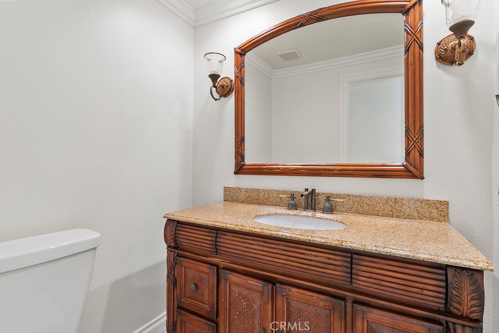 26 Tahoe Irvine, CA 92612 - Photo 29 of 40 a bathroom with a sink and a mirror