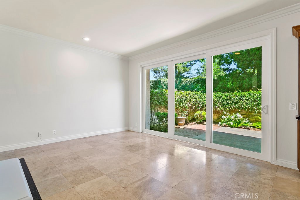 26 Tahoe Irvine, CA 92612 - Photo 31 of 40 a view of an empty room with wooden floor and garden
