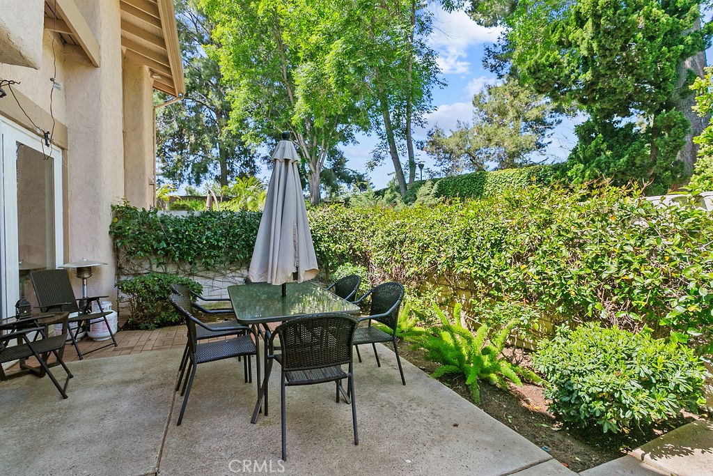 26 Tahoe Irvine, CA 92612 - Photo 7 of 40 a view of a patio with table and chairs and potted plants