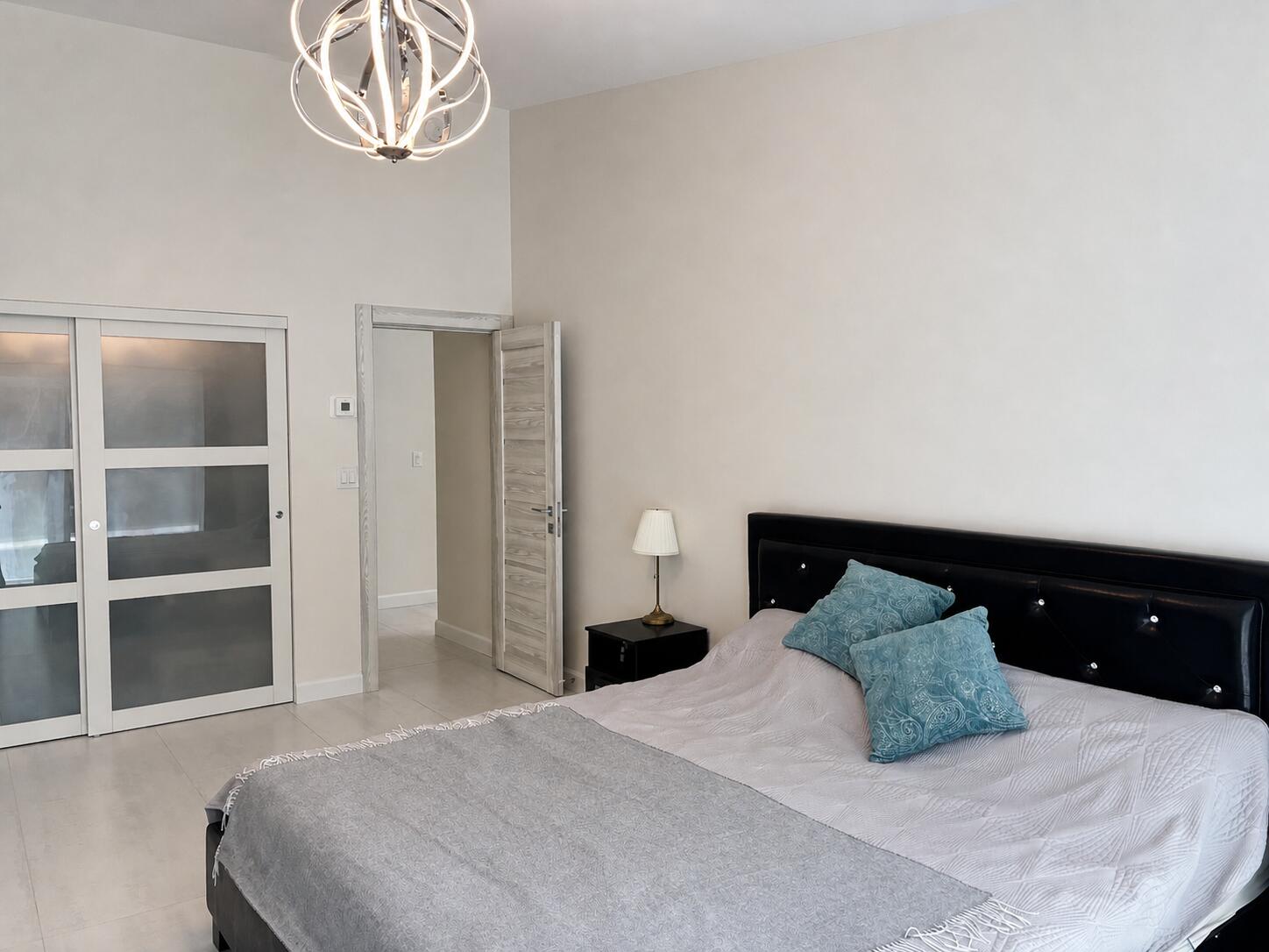 330 Sandalwood Lane Boca Raton, FL 33487 - Photo 12 of 23 a bedroom with a bed and a closet