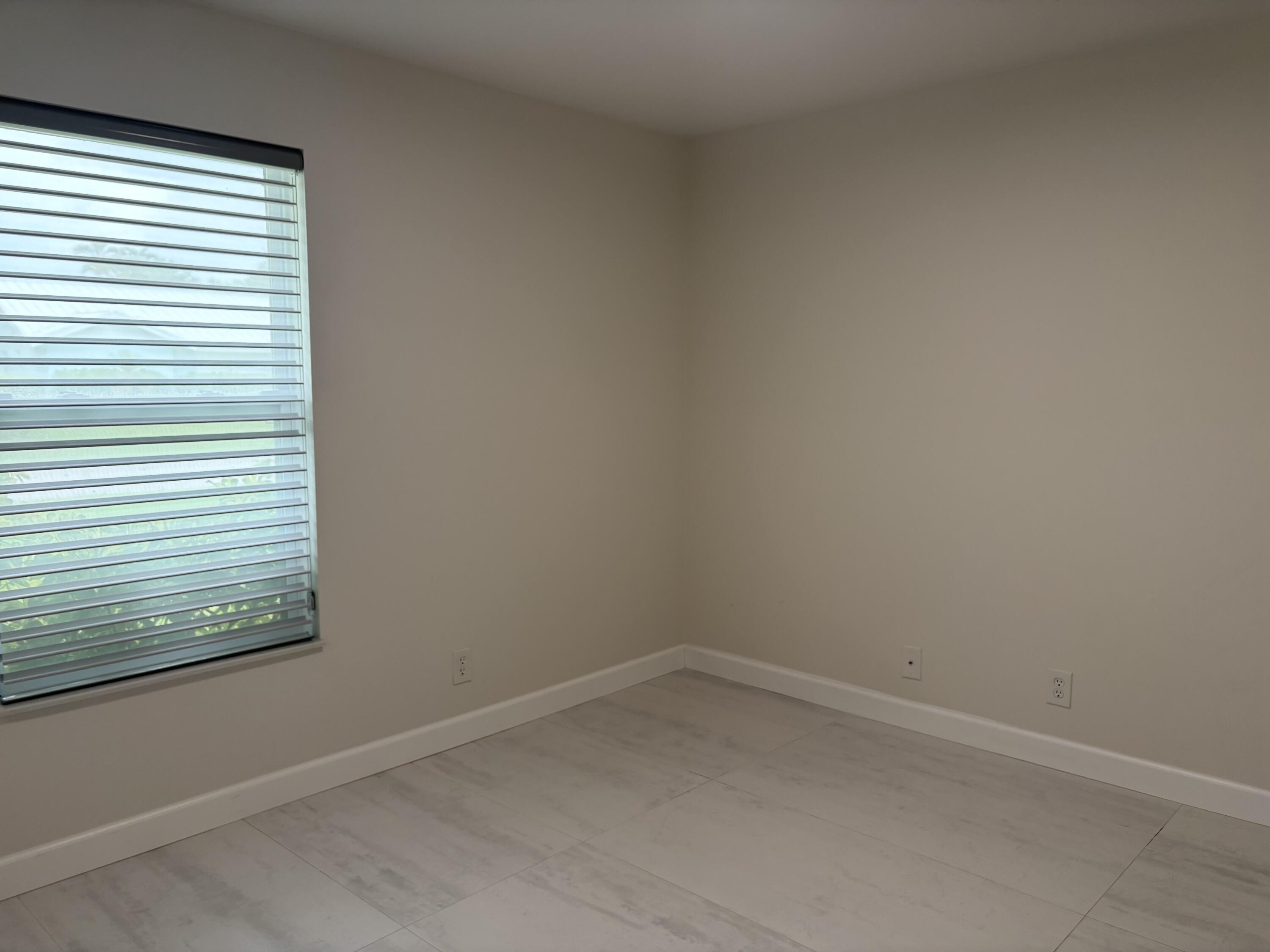 330 Sandalwood Lane Boca Raton, FL 33487 - Photo 20 of 23 a room that has a window in it