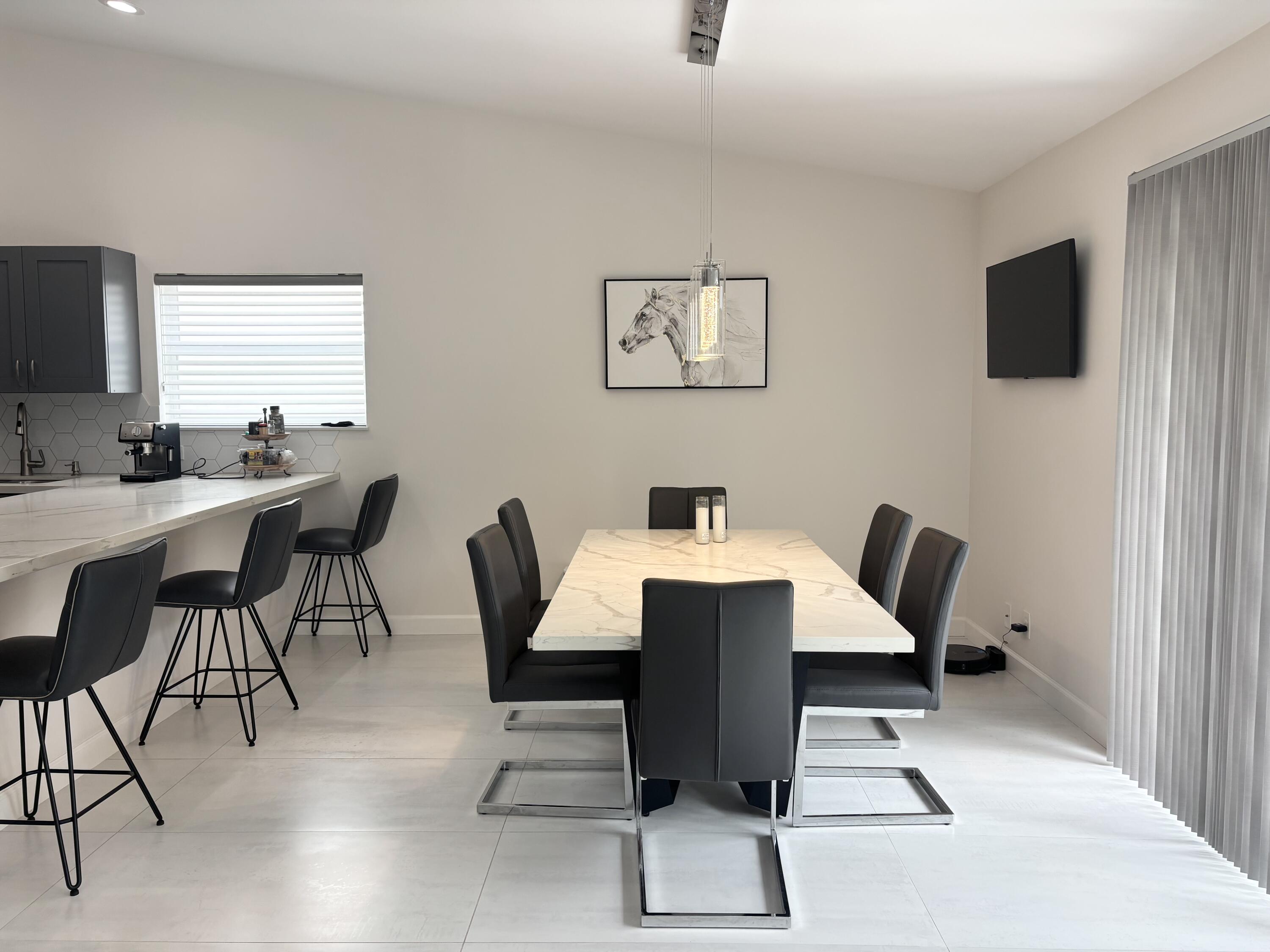 330 Sandalwood Lane Boca Raton, FL 33487 - Photo 5 of 23 a view of a dining room with furniture