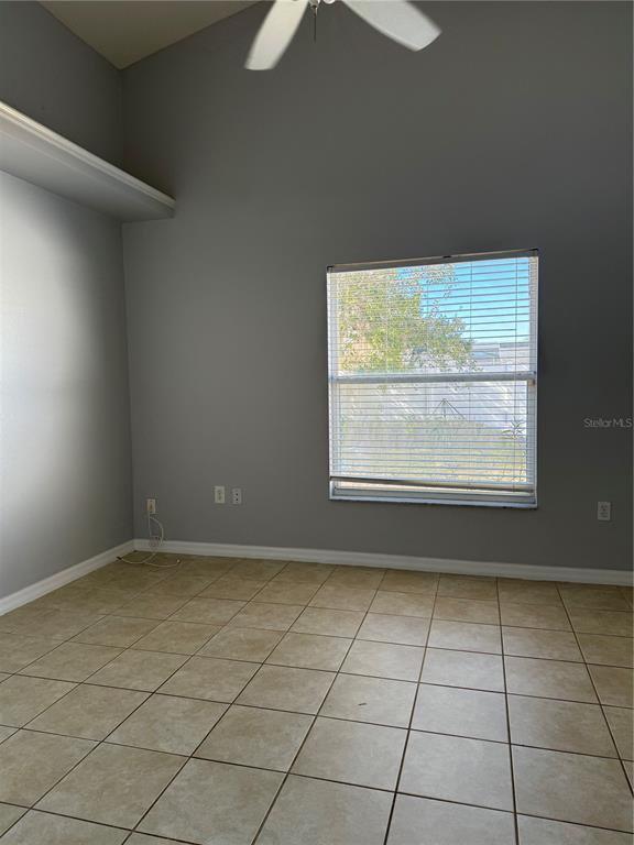 436 Saddle Ridge Drive Davenport, FL 33896 - Photo 11 of 35 an empty room with windows