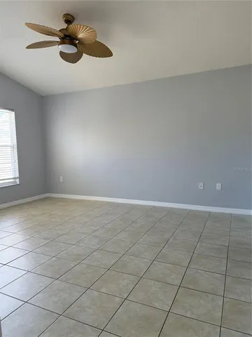 a kitchen with a sink refrigerator and cabinets