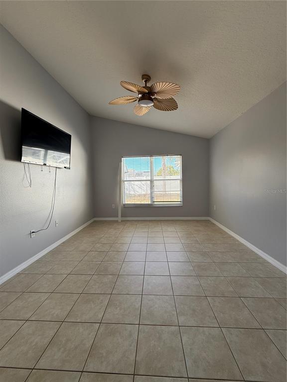 436 Saddle Ridge Drive Davenport, FL 33896 - Photo 15 of 35 a view of an empty room with a window